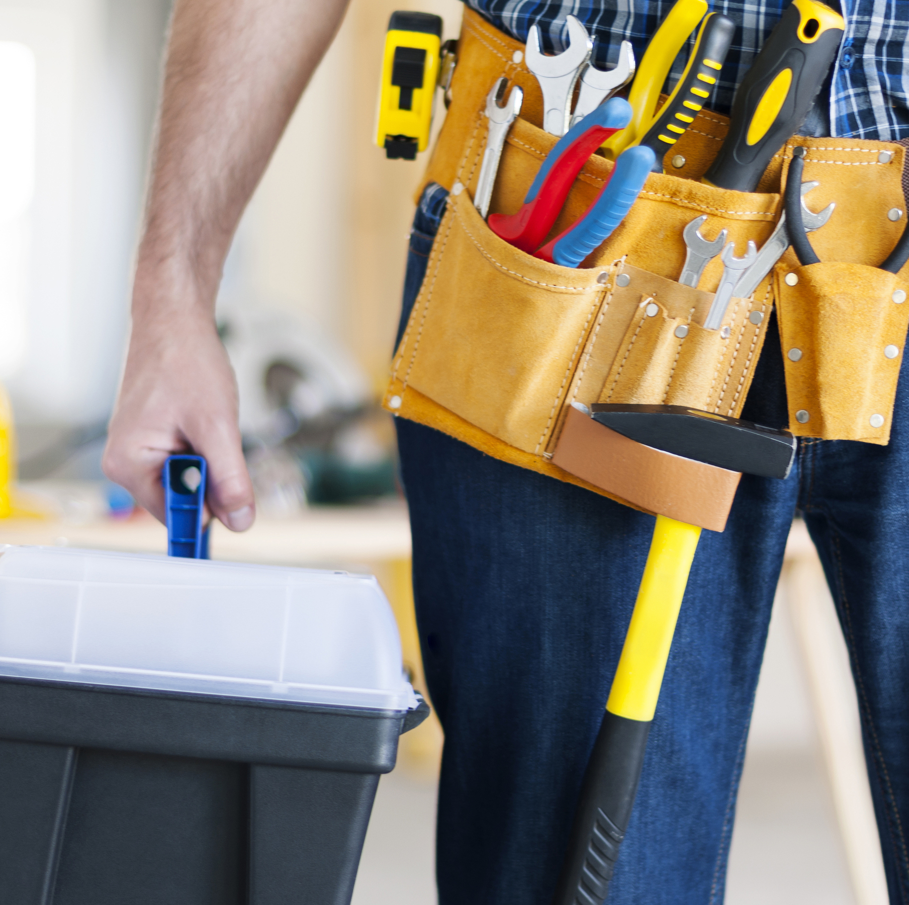 Part of male construction worker with tools